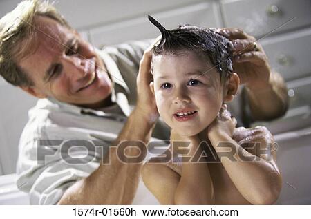 Man giving his son a bath View Large Photo Image Stock Image - Man giving his son a bath. Fotosearch