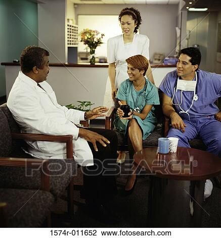 Stock Image - Medical personnel talking. Fotosearch