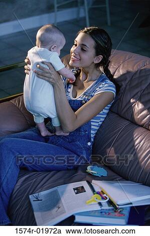 Mother holding her baby boy View Large Photo Image Stock Image - Mother holding her baby boy. Fotosearch