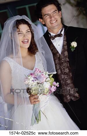 Stock Image - Newlywed couple smiling. Fotosearch