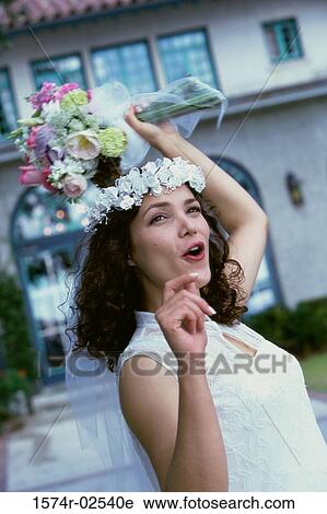 Newlywed young woman preparing to toss the bouquet View Large Photo Image Stock Image - Newlywed young woman preparing to toss the bouquet. Fotosearch