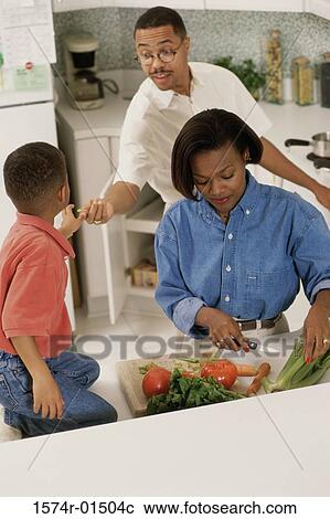 Parents in the kitchen with their son View Large Photo Image Stock Image - Parents in the kitchen with their son. Fotosearch