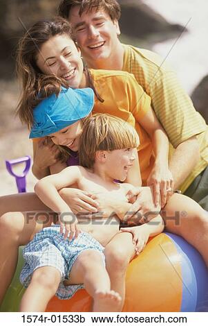 Parents playing with their son and daughter View Large Photo Image Stock Image - Parents playing with their son and daughter. Fotosearch