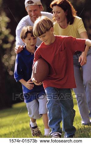 Stock Image - Parents playing with their sons. Fotosearch