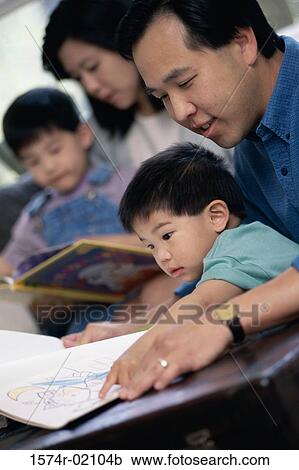 Parents watching their two sons coloring with crayons View Large Photo Image Stock Image - Parents watching their two sons coloring with crayons. Fotosearch