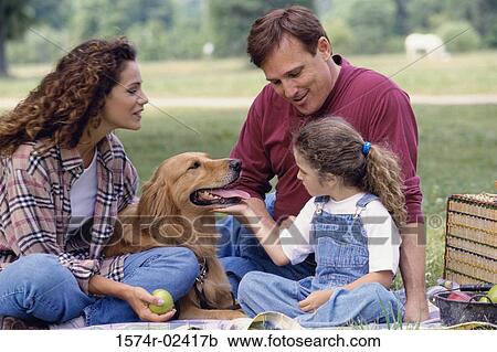 Parents with their daughter and a dog View Large Photo Image Stock Image - Parents with their daughter and a dog. Fotosearch