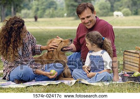 Parents with their daughter and a dog View Large Photo Image Stock Image - Parents with their daughter and a dog. Fotosearch