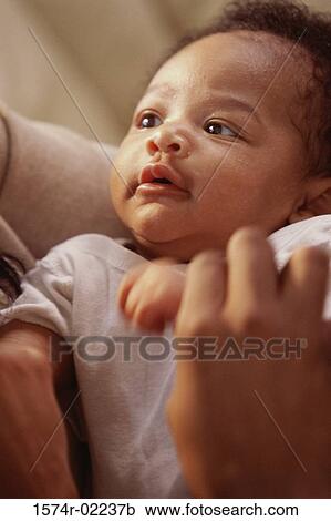 Person holding a baby boy View Large Photo Image Stock Image - Person holding a baby boy. Fotosearch