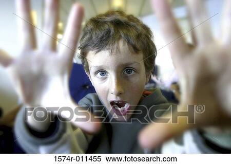 Portrait of a boy making a face View Large Photo Image Stock Photography - Portrait of a boy making a face. Fotosearch