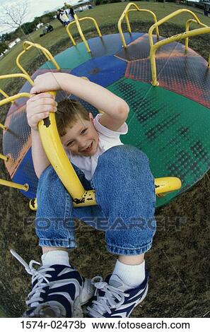 Portrait of a boy on a merry-go-round View Large Photo Image Stock Image - Portrait of a boy on a merry-go-round. Fotosearch