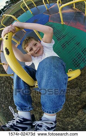 Portrait of a boy on a merry-go-round View Large Photo Image Stock Image - Portrait of a boy on a merry-go-round. Fotosearch