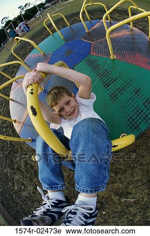 Portrait of a boy on a merry-go-round View Large Photo Image Stock Image - Portrait of a boy on a merry-go-round. Fotosearch