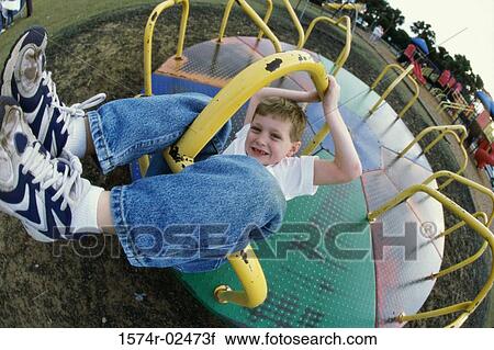 Portrait of a boy on a merry-go-round View Large Photo Image Stock Image - Portrait of a boy on a merry-go-round. Fotosearch