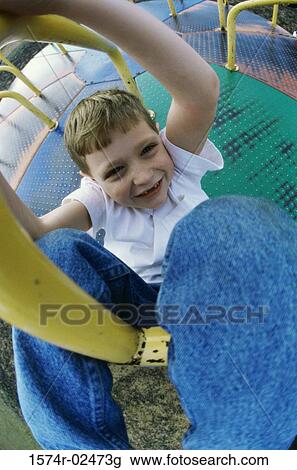 Portrait of a boy on a merry-go-round View Large Photo Image Stock Image - Portrait of a boy on a merry-go-round. Fotosearch