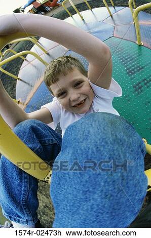 Portrait of a boy on a merry-go-round View Large Photo Image Stock Image - Portrait of a boy on a merry-go-round. Fotosearch