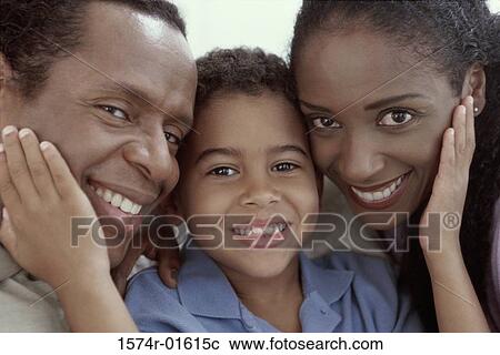 Portrait of a boy with his parents View Large Photo Image Stock Image - Portrait of a boy with his parents. Fotosearch