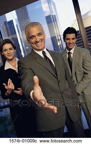 Portrait of a business executive extending his arm to shake hands View Large Photo Image Stock Image - Portrait of a business executive extending his arm to shake hands. Fotosearch