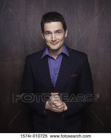 Portrait of a businessman smiling View Large Photo Image Stock Photography - Portrait of a businessman smiling. Fotosearch