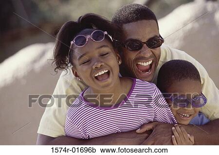 Portrait of a father hugging his children View Large Photo Image Stock Image - Portrait of a father hugging his children. Fotosearch