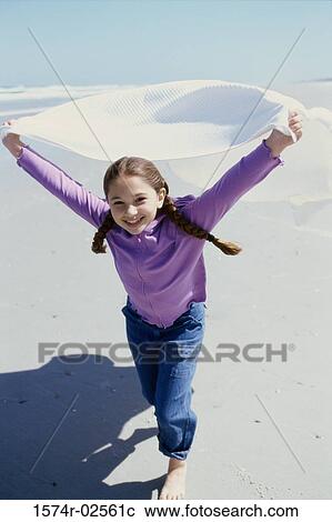 Portrait of a girl running on the beach View Large Photo Image Stock Image - Portrait of a girl running on the beach. Fotosearch