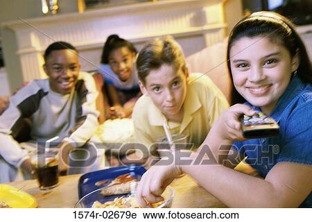 Portrait of a group of children watching television View Large Photo Image Stock Image - Portrait of a group of children watching television. Fotosearch