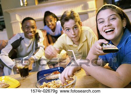 Portrait of a group of children watching television View Large Photo Image Stock Image - Portrait of a group of children watching television. Fotosearch