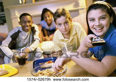 Portrait of a group of children watching television View Large Photo Image Stock Image - Portrait of a group of children watching television. Fotosearch