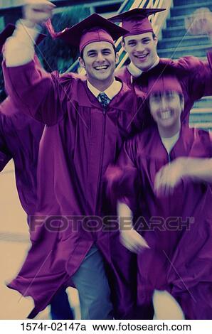 Stock Image - Portrait of a group of college students wearing graduation outfits. Fotosearch