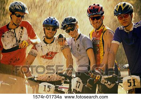 Portrait of a group of cyclists with bicycles View Large Photo Image Stock Image - Portrait of a group of cyclists with bicycles. Fotosearch