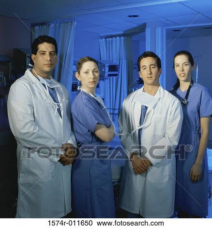 Portrait of a group of surgeons standing together View Large Photo Image Stock Image - Portrait of a group of surgeons standing together. Fotosearch