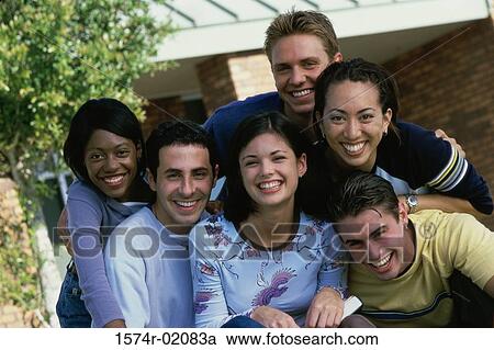 Stock Image - Portrait of a group of teenagers smiling. Fotosearch