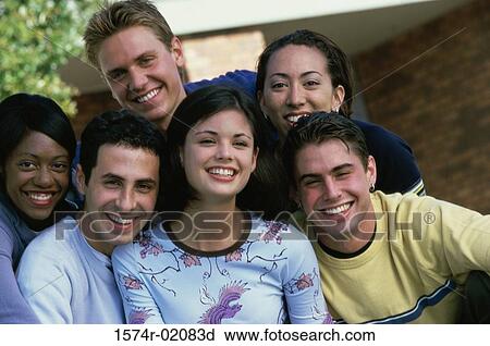 Stock Image - Portrait of a group of teenagers smiling. Fotosearch