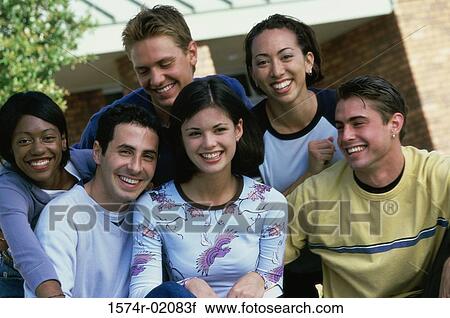 Stock Image - Portrait of a group of teenagers smiling. Fotosearch