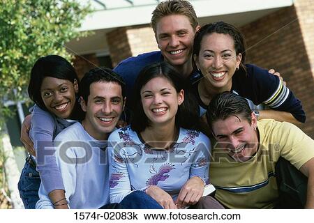Stock Image - Portrait of a group of teenagers smiling. Fotosearch