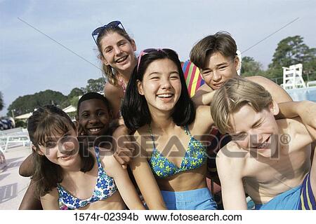 Portrait of a group of teenagers sitting beside a swimming pool View Large Photo Image Stock Image - Portrait of a group of teenagers sitting beside a swimming pool. Fotosearch