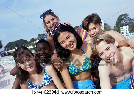 Portrait of a group of teenagers sitting beside a swimming pool View Large Photo Image Stock Image - Portrait of a group of teenagers sitting beside a swimming pool. Fotosearch