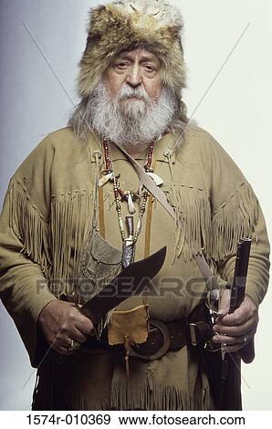 Stock Photo - Portrait of a senior man holding a knife. Fotosearch