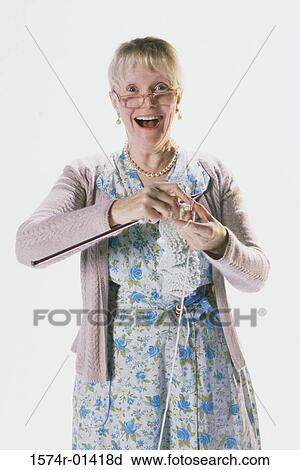 Portrait of a senior woman knitting View Large Photo Image Stock Image - Portrait of a senior woman knitting. Fotosearch