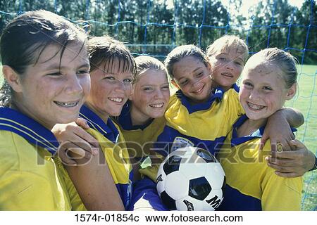Stock Image - Portrait of a smiling girls soccer team. Fotosearch