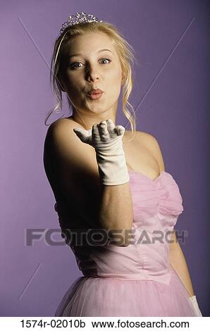 Portrait of a teenage girl blowing a kiss View Large Photo Image Stock Image - Portrait of a teenage girl blowing a kiss. Fotosearch