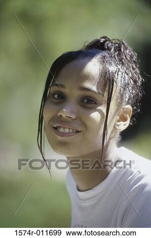Stock Photo - Portrait of a teenage girl smiling. Fotosearch