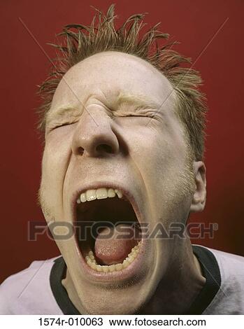 Portrait of a young man screaming in anger View Large Photo Image Stock Image - Portrait of a young man screaming in anger. Fotosearch