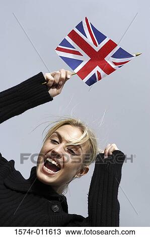 Portrait of a young woman holding a flag View Large Photo Image Stock Image - Portrait of a young woman holding a flag. Fotosearch