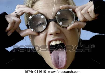 Portrait of a young woman making a face View Large Photo Image Stock Image - Portrait of a young woman making a face. Fotosearch