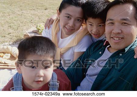 Portrait of parents with their children at a picnic View Large Photo Image Stock Image - Portrait of parents with their children at a picnic. Fotosearch