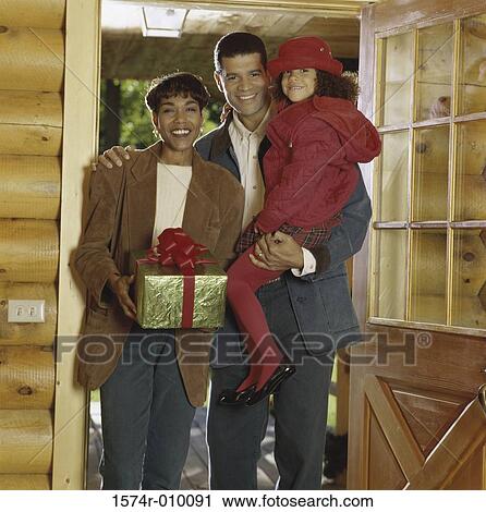 Portrait of parents with their daughter smiling View Large Photo Image Stock Image - Portrait of parents with their daughter smiling. Fotosearch