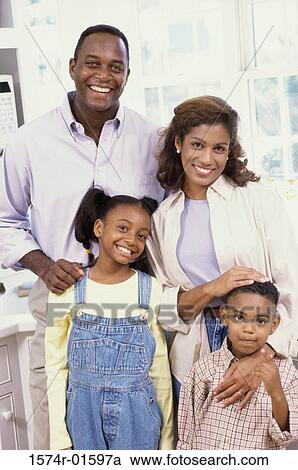 Stock Image - Portrait of parents with their son and daughter. Fotosearch