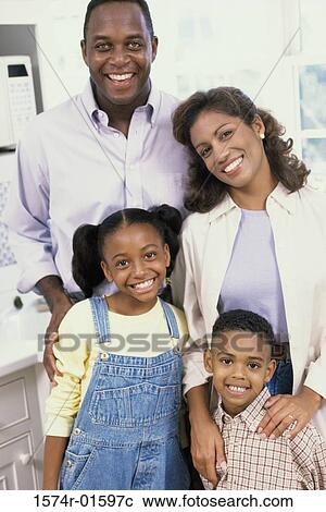 Stock Image - Portrait of parents with their son and daughter. Fotosearch
