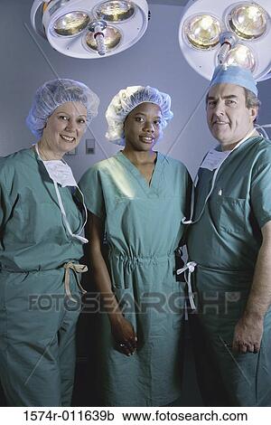 Portrait of three surgeons in an operating room View Large Photo Image Stock Image - Portrait of three surgeons in an operating room. Fotosearch