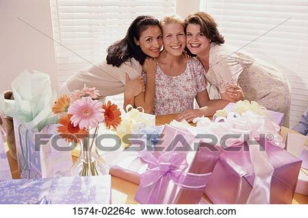 Portrait of three young women at a baby shower View Large Photo Image Stock Image - Portrait of three young women at a baby shower. Fotosearch